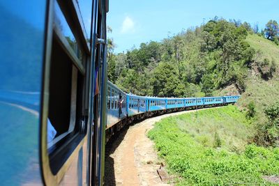 Train on railroad track against sky