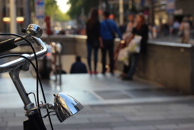 Close-up of padlock on bicycle in city