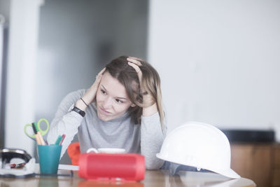 Young woman with long hair learning at home