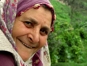 Close-up portrait of smiling grandma 