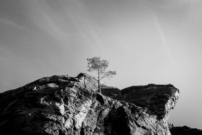 Low angle view of rock formation against sky