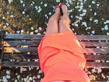 Low section of woman standing outdoors