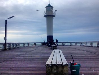 People walking on pier