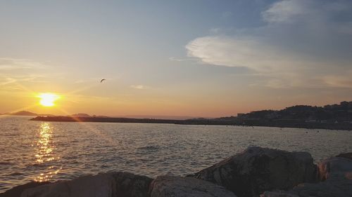 View of sea against sunset sky