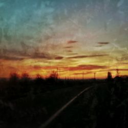 Scenic view of landscape against dramatic sky