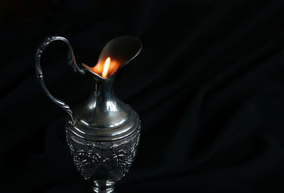 Close-up of illuminated candle