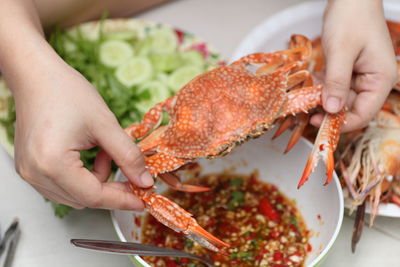 Midsection of woman preparing food