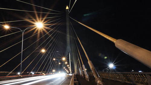 Light trails on suspension bridge at night