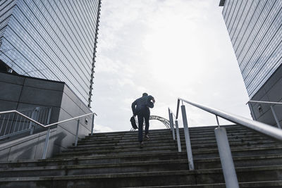 Businessman running upstairs