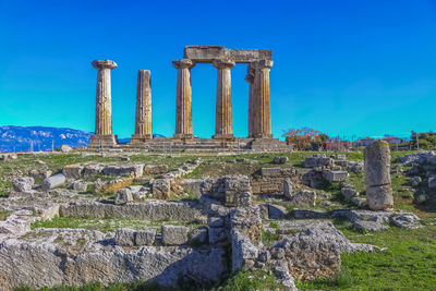 Old ruins of temple against blue sky