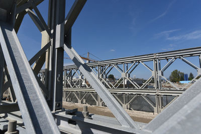 Bridge against sky in city