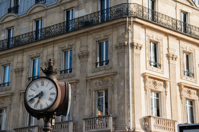 Low angle view of clock on building