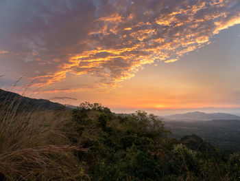 Scenic view of mountains against sky during sunset