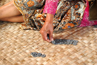 Low section of woman sitting on floor