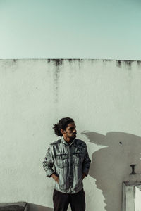 Young man looking at wall