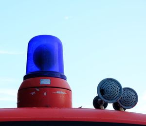 Close-up of camera against clear blue sky