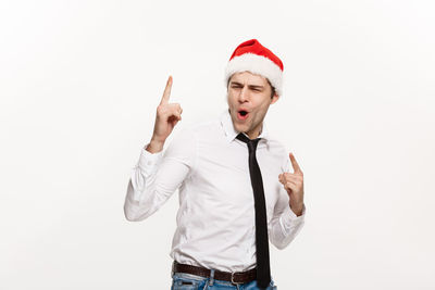 Full length of man wearing hat while standing against white background