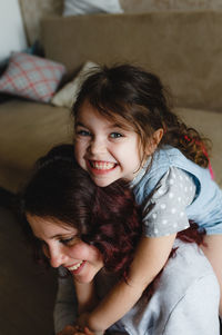 Portrait of a smiling girl at home