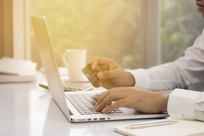 Man using laptop on table