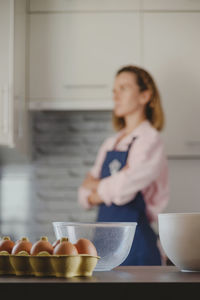 Woman preparing food in kitchen at home