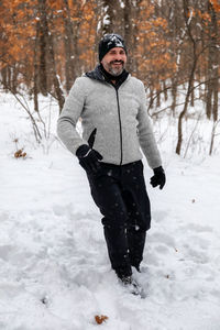 Man standing on snow covered land