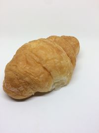 Close-up of bread against white background