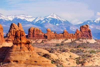 View of rock formations against cloudy sky