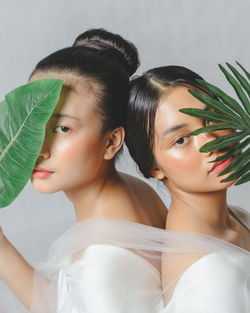 Portrait of two beautiful young women posing for the camera.