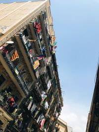 Low angle view of buildings against sky in city