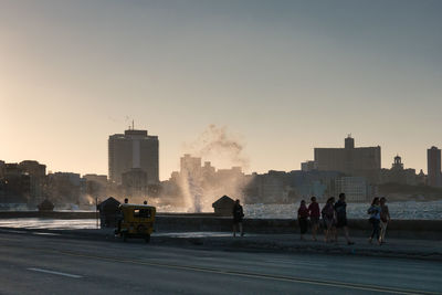 Silhouette of city at sunset