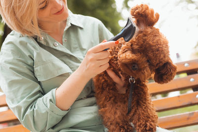 Midsection of woman with dog
