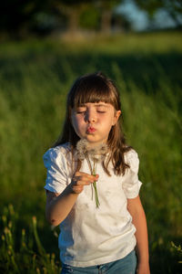 Girl standing on field