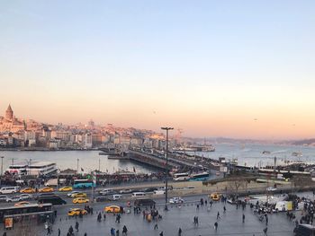 High angle view of crowd in city against sky during sunset