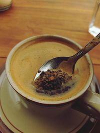 A cup of coffee on a wooden table