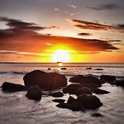Scenic view of sea at sunset