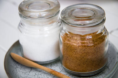 Close-up of ice cream in glass jar on table