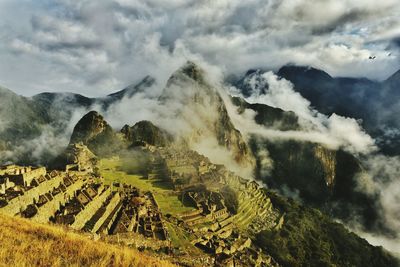 Aerial view of landscape against cloudy sky