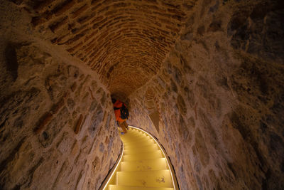 Person standing in cave