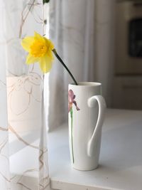 Close-up of white flower vase on table