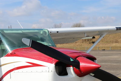 Close-up of airplane against sky