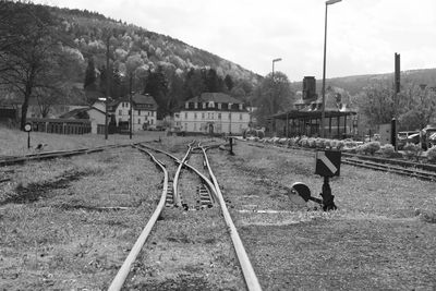 Train on railroad track against sky