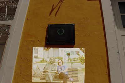 Low angle view of clock on wall