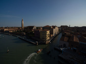 High angle view of river amidst buildings in city