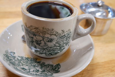 Close-up of tea cup on table