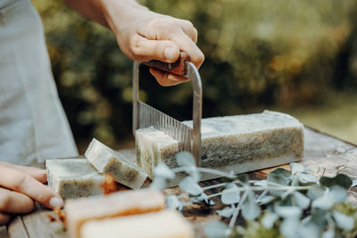 Making handmade natural soaps on an old wooden table