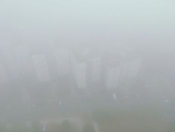 Full frame shot of wet glass window in city