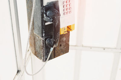 Close-up of clothes hanging on white wall