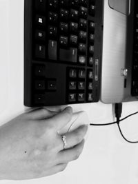 Close-up of hand using laptop