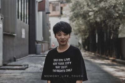 Portrait of teenage boy standing outdoors