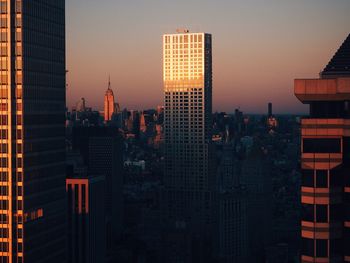 Illuminated cityscape at dusk